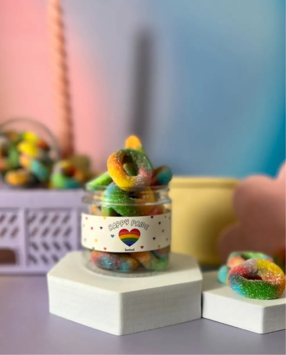 Happy Pride Ingredients: Glucose Syrup, Sugar,Beef (Gelatine) Corn Starch, Water, Acids (Citric Acid, Malic Acid), Colours (E133, E129, E102).