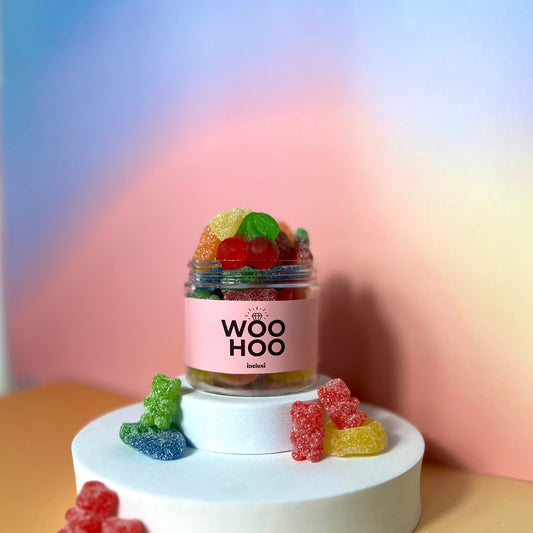 Jar of colourful vegan and gluten free sweets celebrating an engagement gift