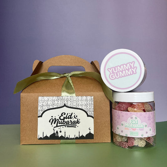 A gift set with an Eid Mubarak print and a clear jar containing halal sweets.
