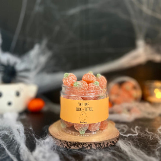Jar of vegan and gluten free halloween pumpkin sweets labelled you're bootiful