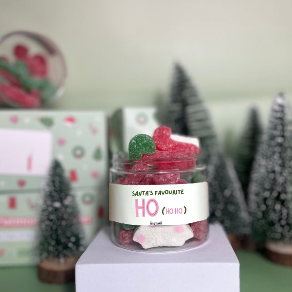 Jar of gluten and dairy free sweets with the slogan santas favourite hoe