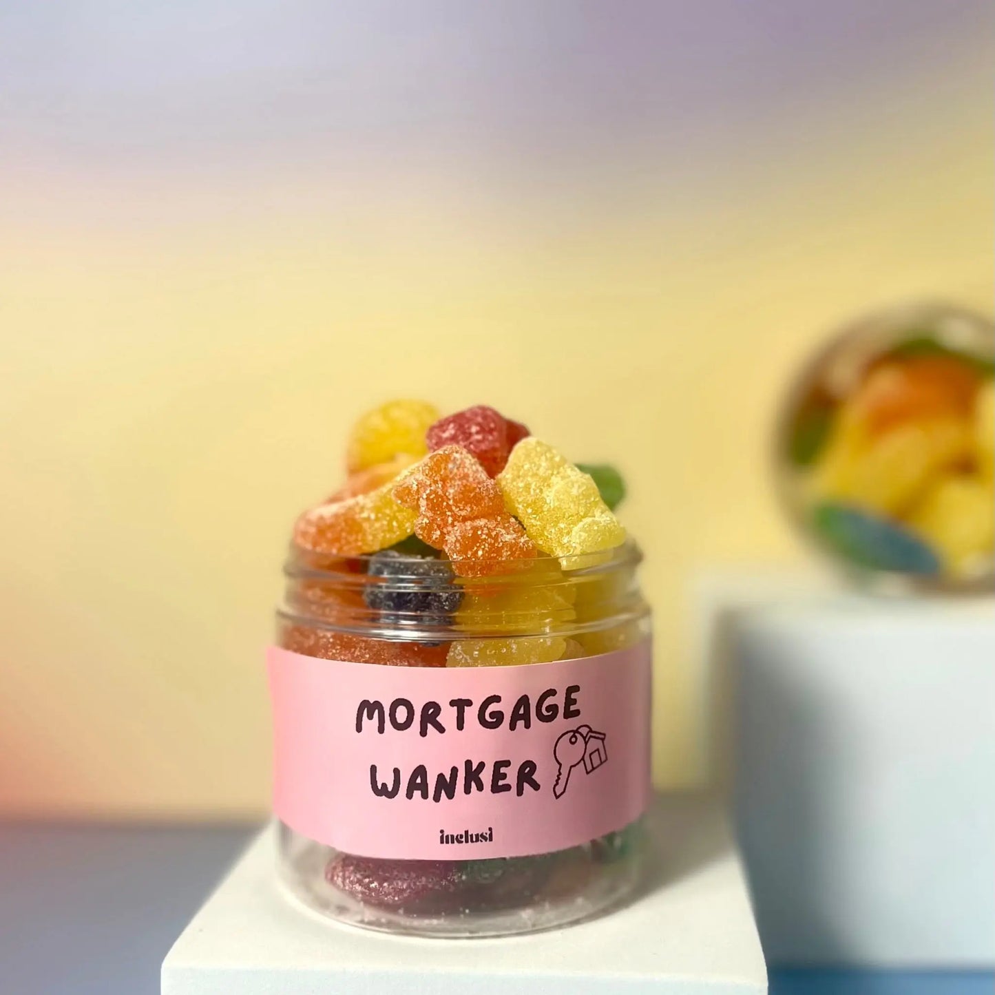 A jar of colourful vegan and gluten free sweets to celebrate a new home. Funny gifting