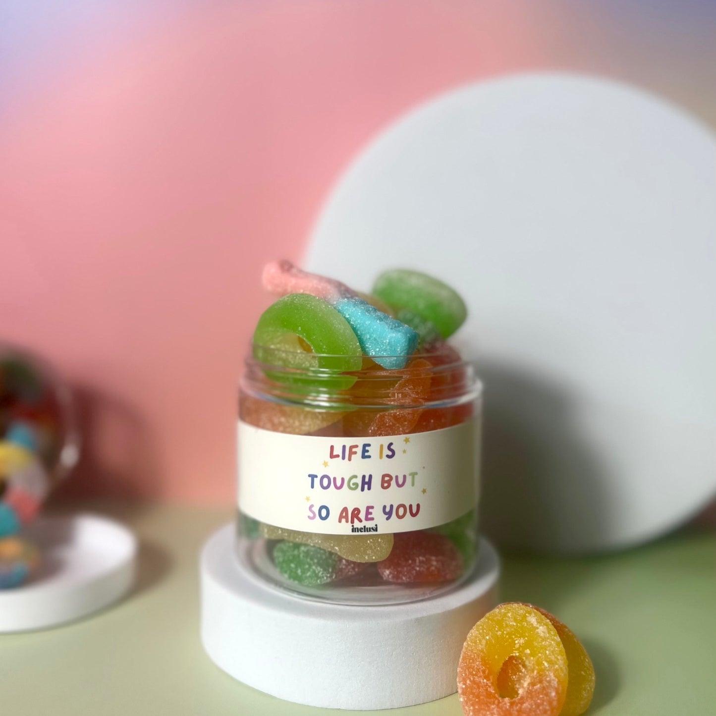 A jar of gluten free and vegan sweets with the message 'life is tough but so are you' a perfect gift for someone you're thinking about