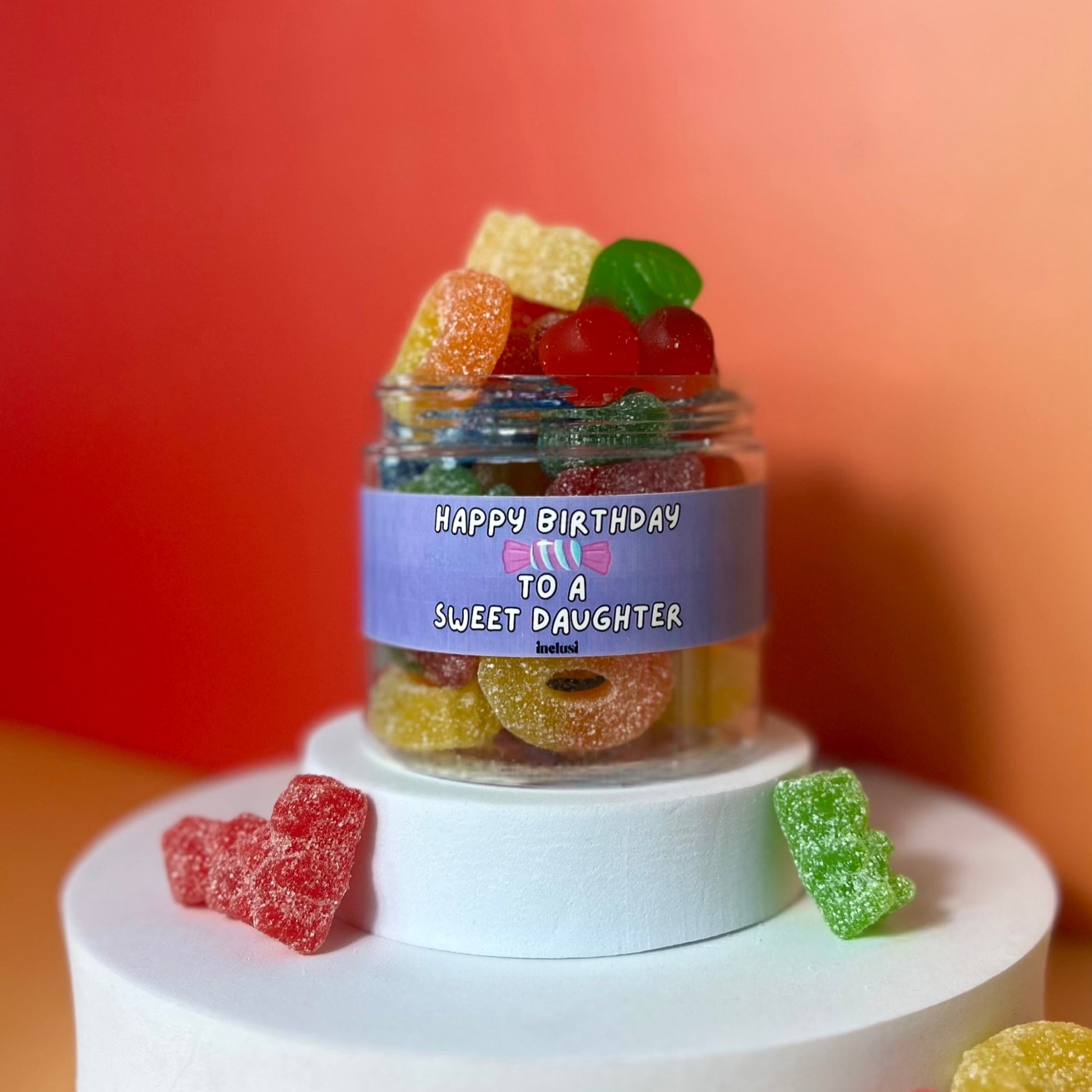 Jar of colourful vegan and gluten free sweets for daughters birthday