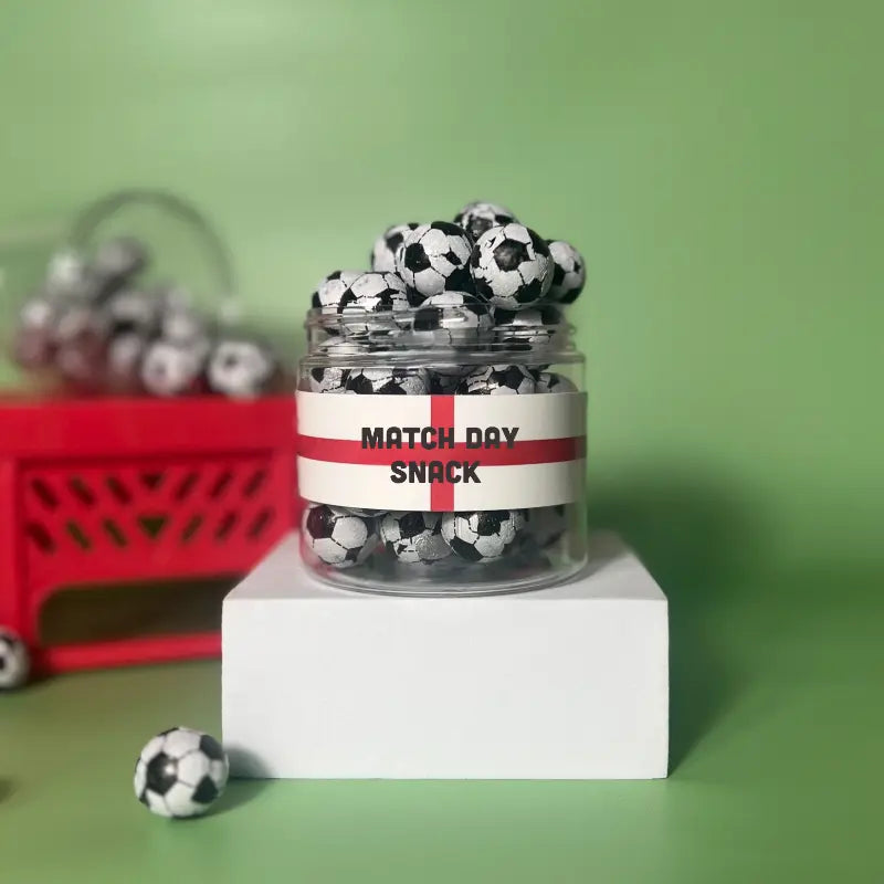 A jar filled with chocolate footballs for match day games